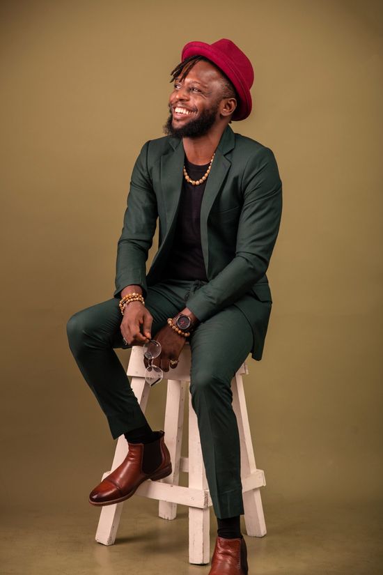 Adepoju 'Peejay' Bakare seated portrait